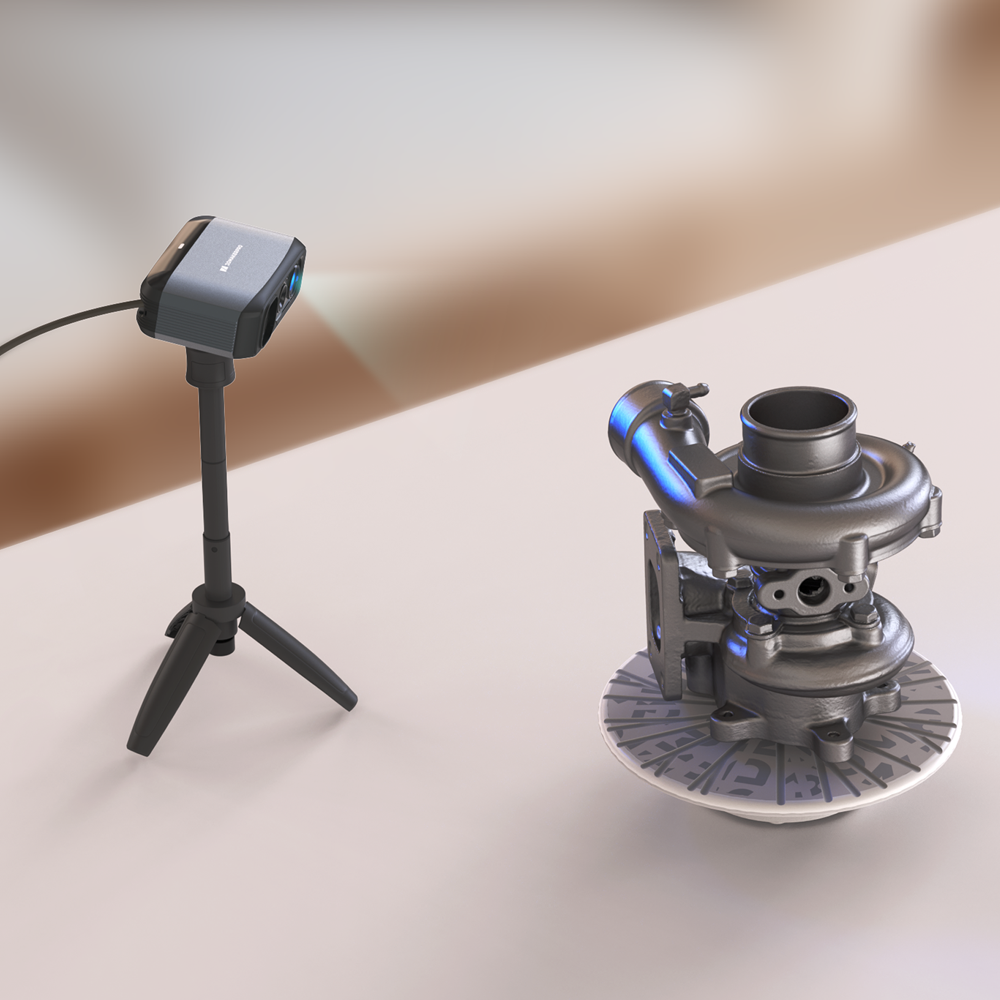 The handheld 3D scanner 3DMakerpro Moose using blue LED on a tripod, scanning a metal turbine on a turntable.