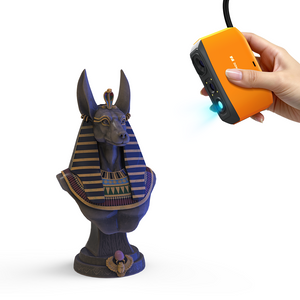 3DMakerpro Fox 3D Scanner used handheld, utilizing its NIR light source to scan a dark matte Anubis bust.